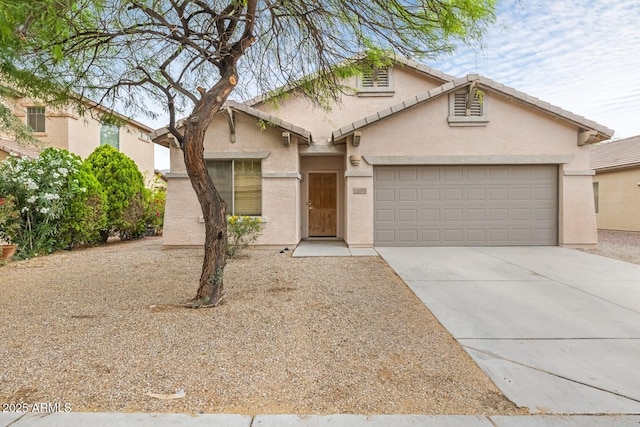 11702 W Lincoln St, Avondale, AZ 85323 - traditional-style home with driveway, a garage, and stucco siding