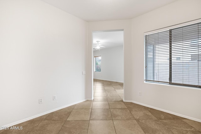 11702 W Lincoln St, Avondale, AZ 85323 - tiled spare room featuring a ceiling fan and baseboards