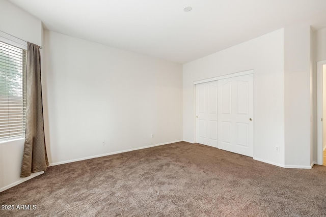 11702 W Lincoln St, Avondale, AZ 85323 - unfurnished bedroom featuring carpet floors, baseboards, and a closet