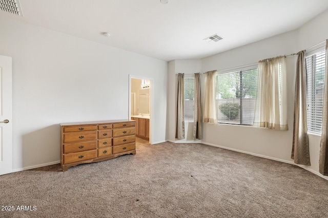 11702 W Lincoln St, Avondale, AZ 85323 - unfurnished bedroom with carpet floors, multiple windows, and baseboards