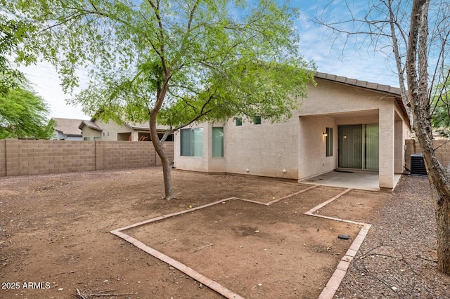 11702 W Lincoln St, Avondale, AZ 85323 - rear view of house featuring a fenced backyard, stucco siding, central AC, and a patio area