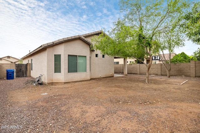 11702 W Lincoln St, Avondale, AZ 85323 - rear view of house with a fenced backyard and stucco siding