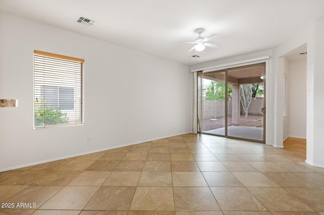 11702 W Lincoln St, Avondale, AZ 85323 - spare room featuring ceiling fan, baseboards, and light tile patterned floors