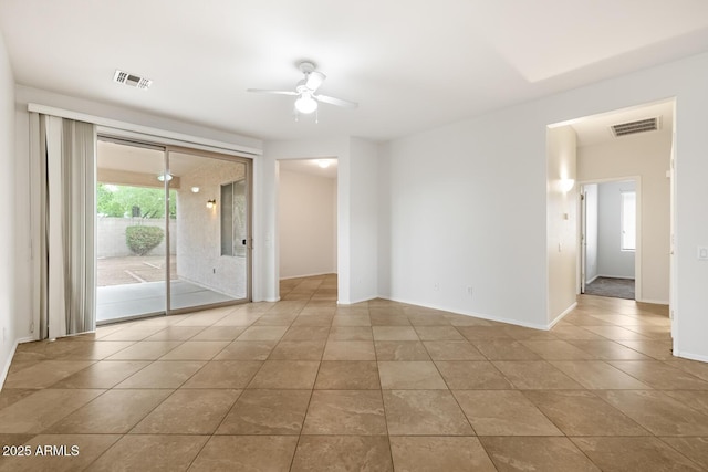 11702 W Lincoln St, Avondale, AZ 85323 - unfurnished room featuring ceiling fan, tile patterned flooring, and baseboards