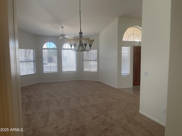 11109 W Amelia Ave, Avondale, AZ 85392 - unfurnished dining area featuring carpet flooring, a chandelier, and ceiling fan