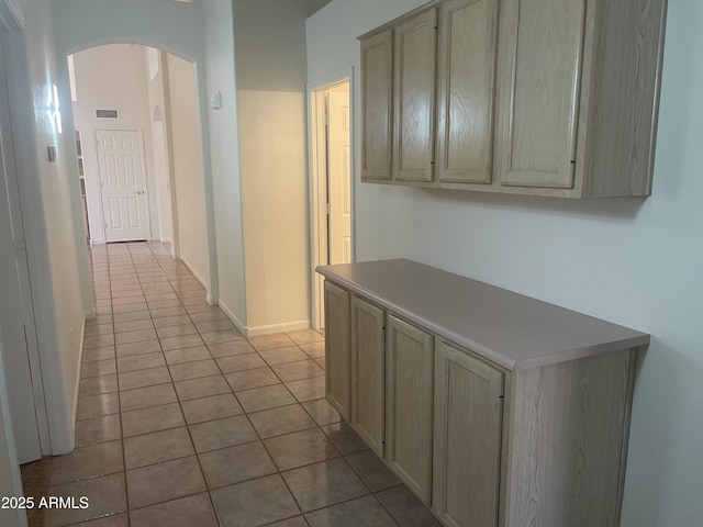 11109 W Amelia Ave, Avondale, AZ 85392 - hallway featuring arched walkways and tile patterned flooring