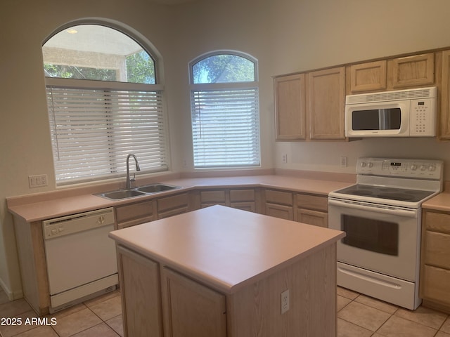 11109 W Amelia Ave, Avondale, AZ 85392 - kitchen with white appliances, light tile patterned flooring, light countertops, and a center island