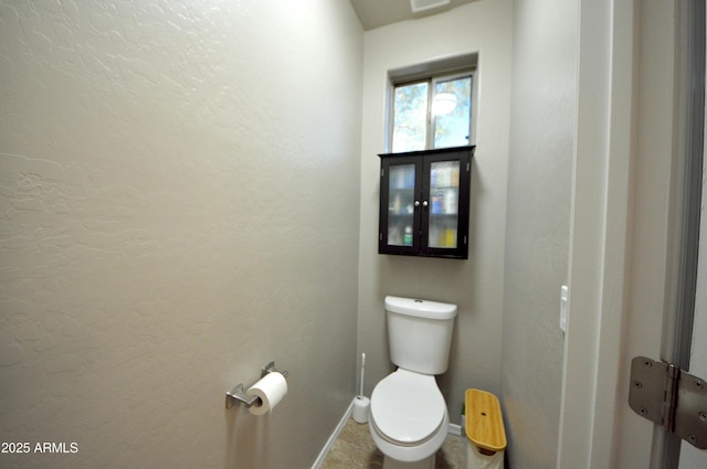 bathroom featuring toilet