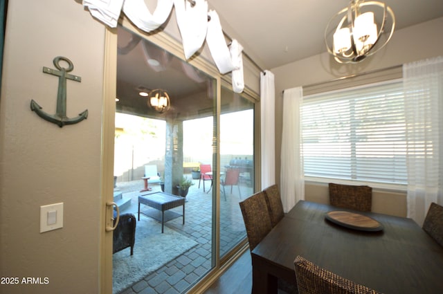 dining area with an inviting chandelier