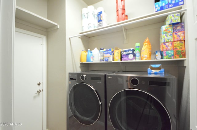 laundry area with laundry area and washer and clothes dryer