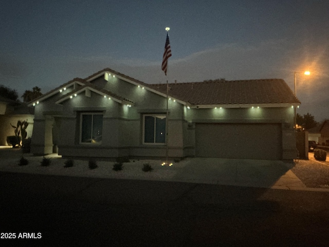 view of front of property with a garage and driveway