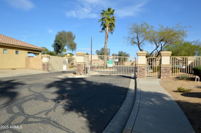 view of gate featuring fence