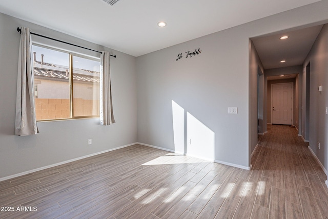 unfurnished room with light hardwood / wood-style flooring