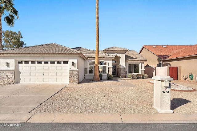 mediterranean / spanish-style house featuring driveway, stone siding, a tiled roof, an attached garage, and stucco siding