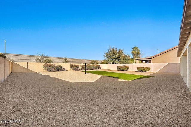 view of yard with a fenced backyard