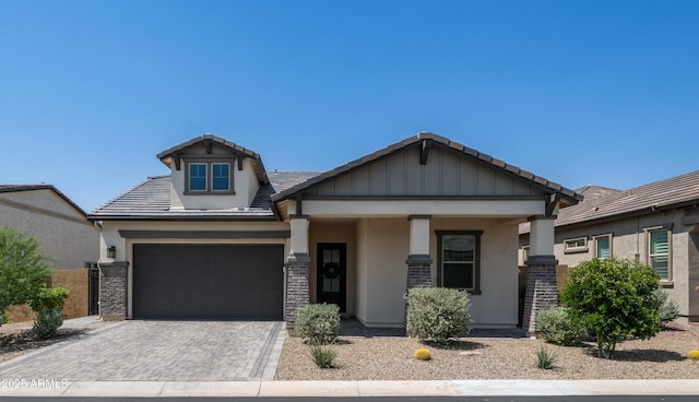 8140 E June St, Mesa, AZ 85207 - craftsman house with stucco siding, decorative driveway, an attached garage, and a tiled roof