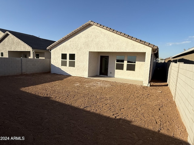 rear view of house with a patio