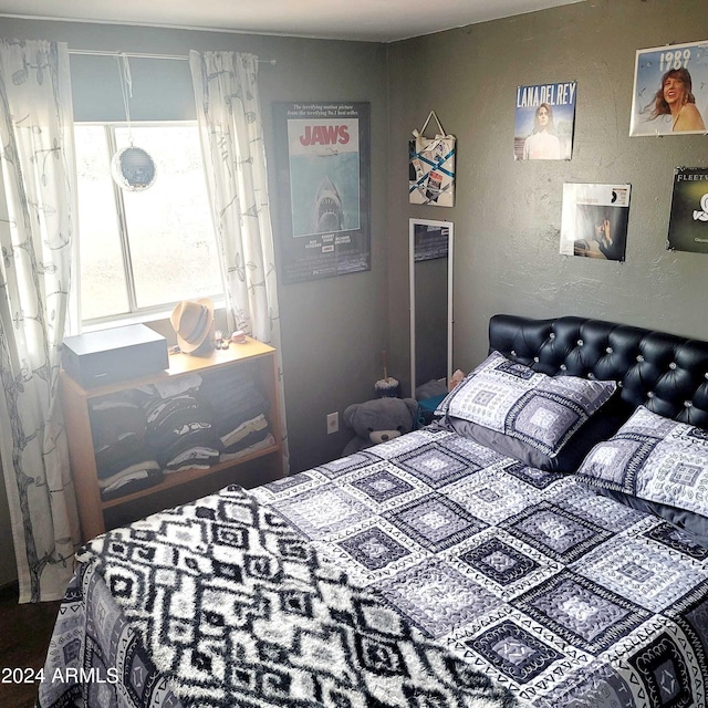 bedroom with a textured wall