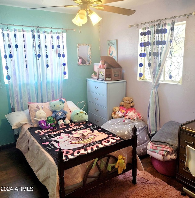 bedroom with ceiling fan and wood finished floors