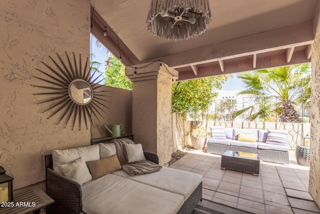 view of patio / terrace with outdoor lounge area and fence