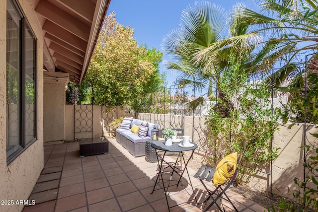 view of patio with fence and an outdoor hangout area