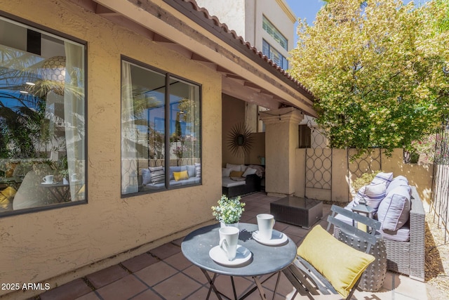 view of patio / terrace with outdoor lounge area and fence