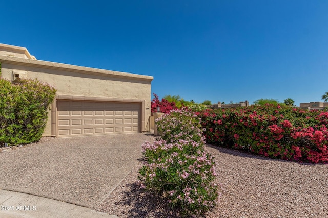 garage with concrete driveway