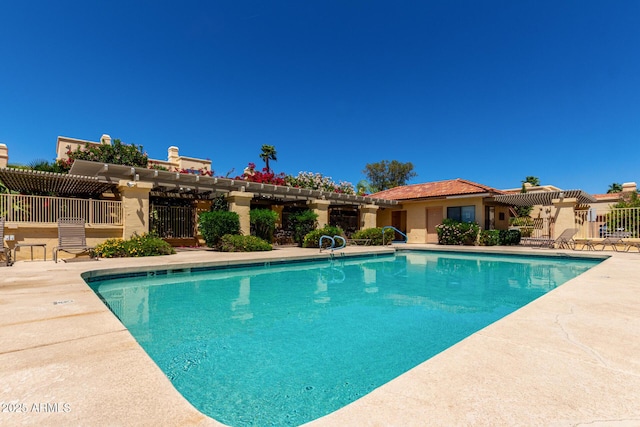 pool featuring a pergola, a patio, and fence