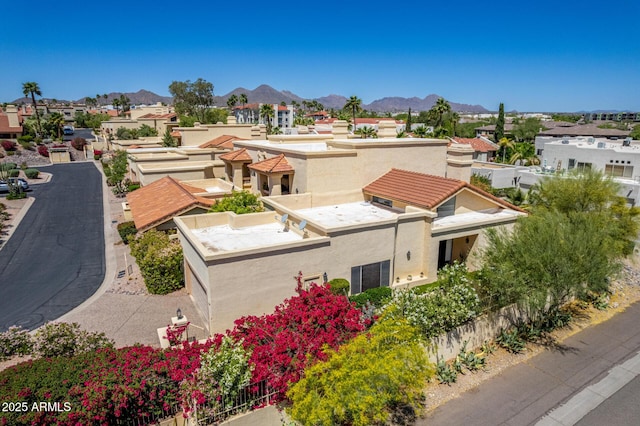 drone / aerial view with a mountain view and a residential view