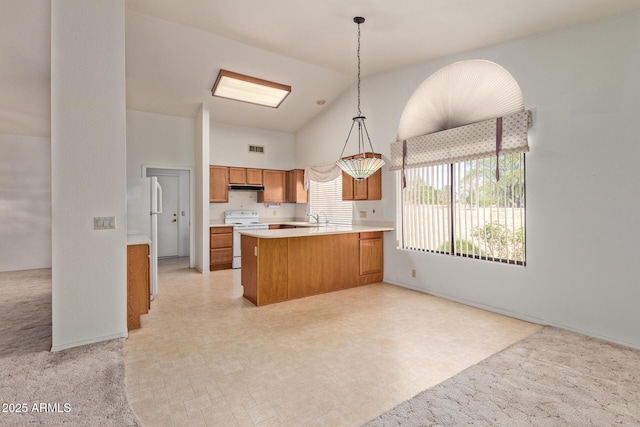 kitchen featuring visible vents, high vaulted ceiling, under cabinet range hood, white range with electric stovetop, and brown cabinets