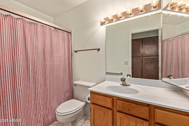 bathroom featuring vanity, a textured wall, toilet, and a shower with curtain