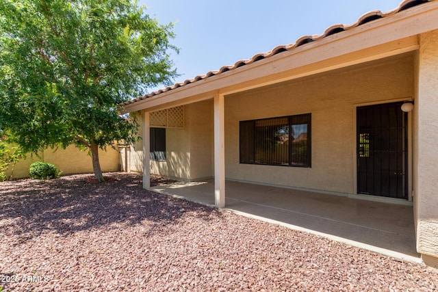 exterior space with fence and a patio area
