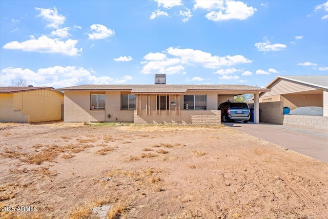 ranch-style home with a carport