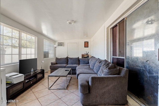 tiled living room featuring a wall unit AC