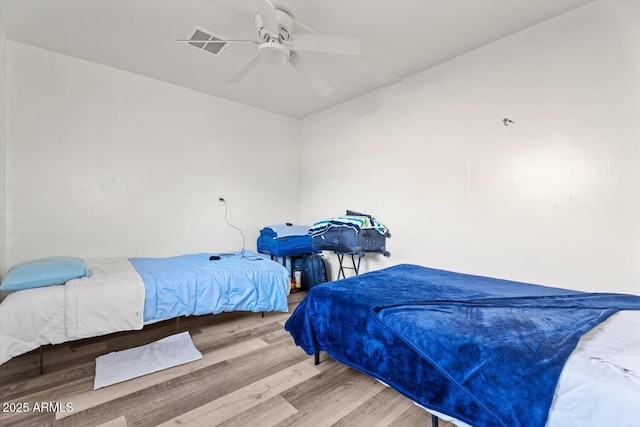 bedroom featuring ceiling fan and wood-type flooring