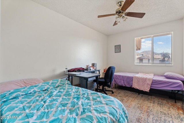 bedroom featuring a textured ceiling, ceiling fan, and hardwood / wood-style floors