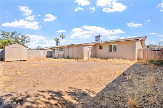 back of property with a storage unit