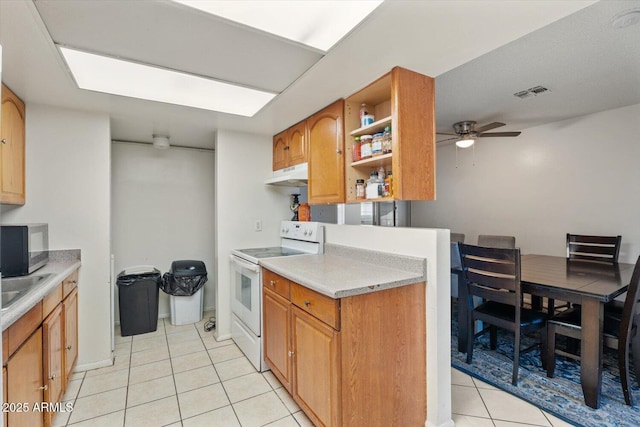 kitchen with ceiling fan, light tile patterned floors, sink, and white electric stove