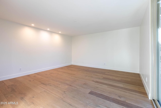 spare room with light wood-type flooring