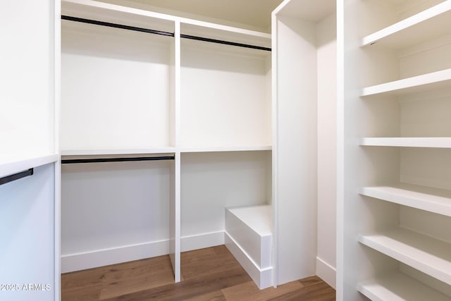 spacious closet featuring hardwood / wood-style floors