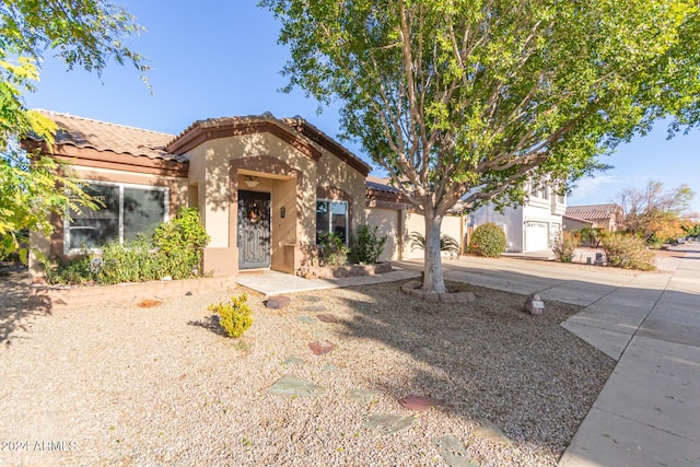 mediterranean / spanish-style house featuring a garage