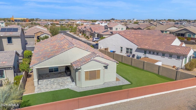 birds eye view of property with a residential view