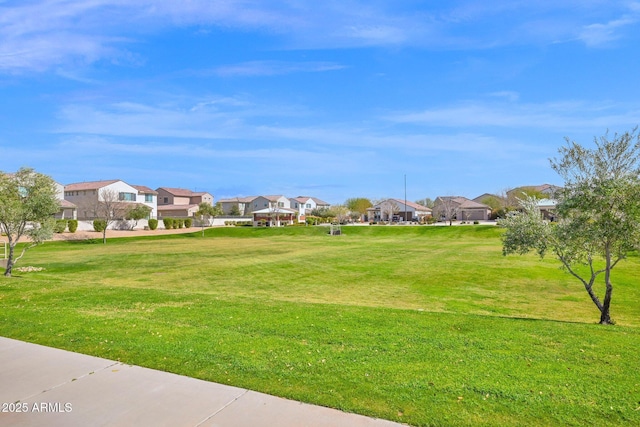 view of community with a residential view and a lawn