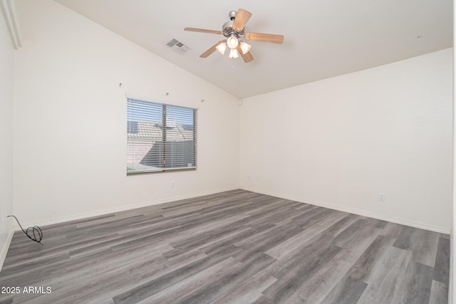 unfurnished room featuring wood finished floors, baseboards, visible vents, lofted ceiling, and ceiling fan