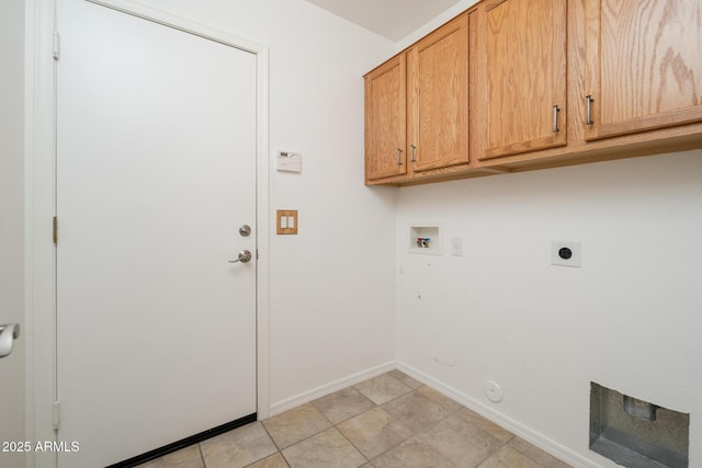 washroom with baseboards, washer hookup, hookup for a gas dryer, cabinet space, and hookup for an electric dryer