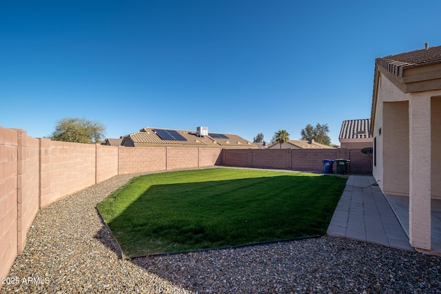 view of yard with a fenced backyard