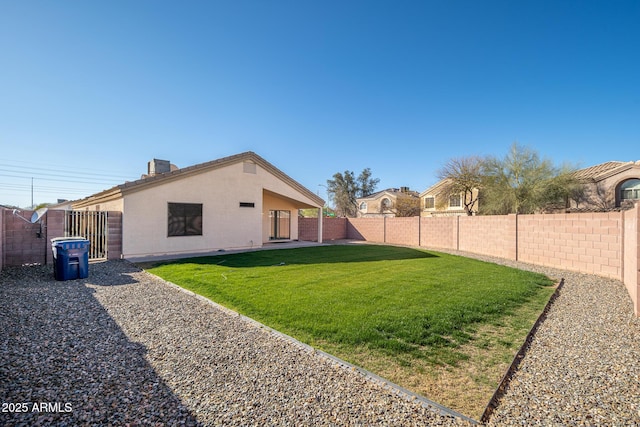 exterior space with a patio area and a fenced backyard