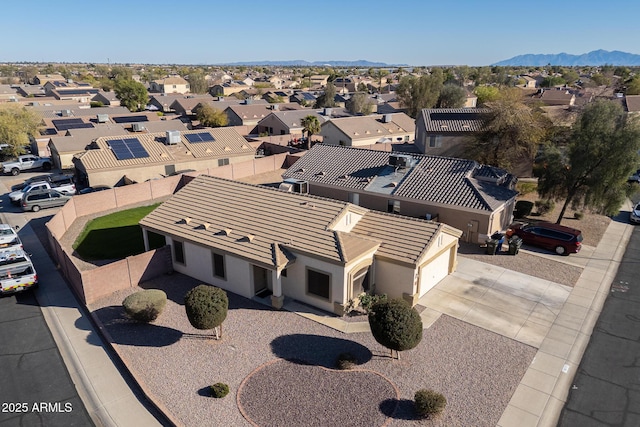 drone / aerial view featuring a mountain view and a residential view