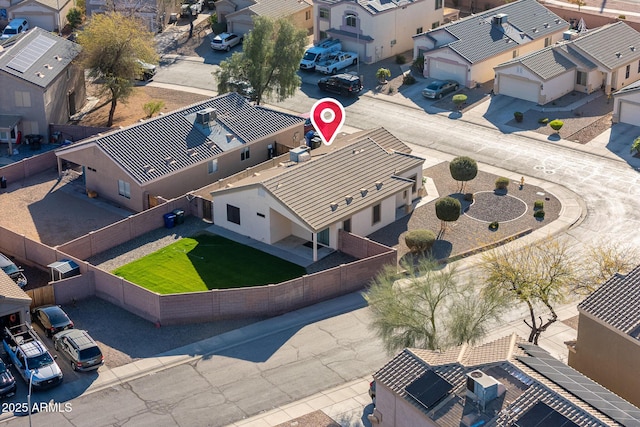 birds eye view of property with a residential view