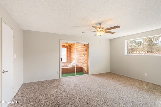 unfurnished bedroom with a textured ceiling, a closet, ceiling fan, and carpet flooring